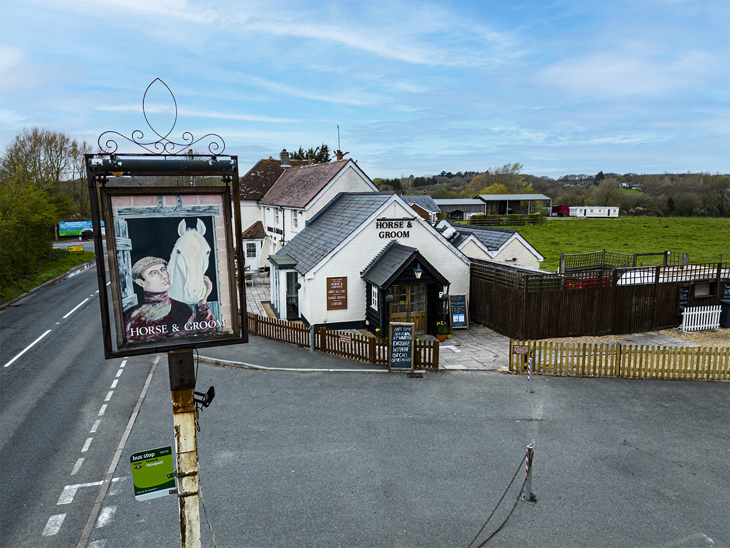 an overhead photo of the horse and groom sign with the pub in the background